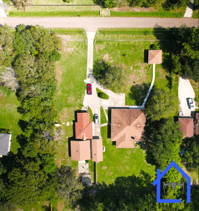 Nader photo of a property with multiple buildings.